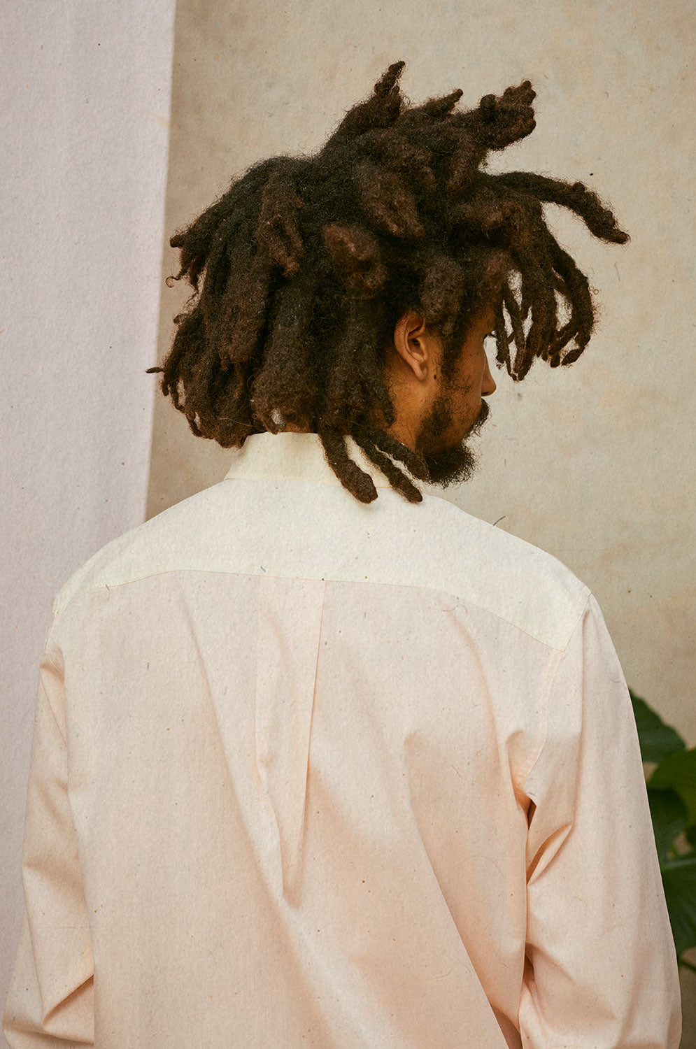 Back detail of Eddy men's patchwork shirt showing contrast yoke and box pleat, made in London by Saywood