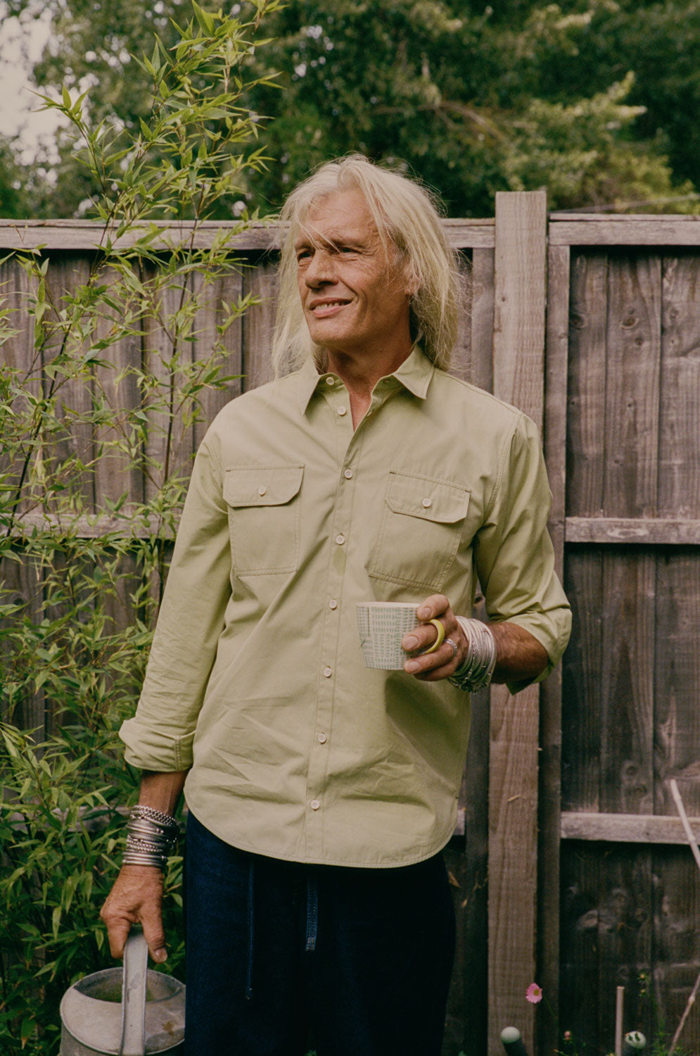 Styling inspiration: Eddy men's khaki utility shirt in heavyweight cotton, relaxed fit, made in East London by Saywood. Worn with dark indigo jeans.