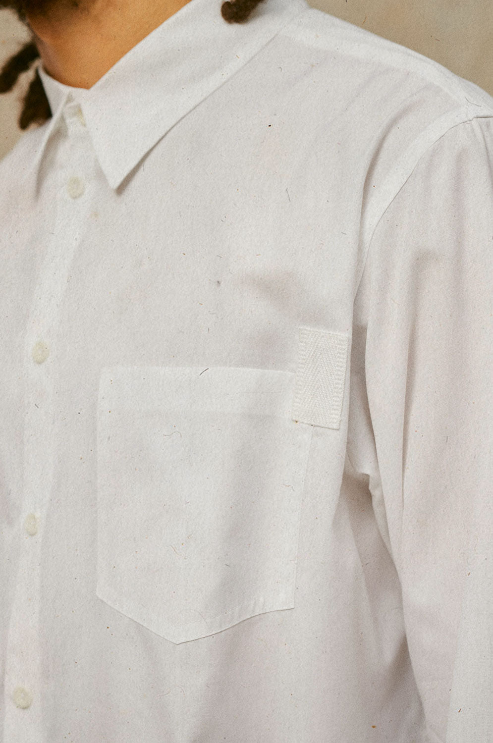 Close-up of Eddy white patch pocket shirt with herringbone tape trim detail, cotton bamboo by Saywood