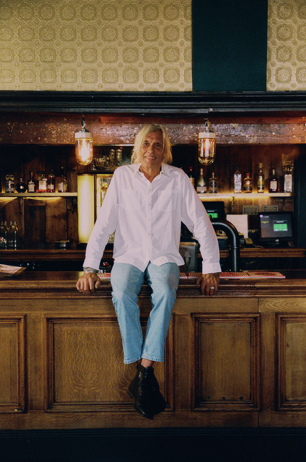 Eddy men's white patch pocket shirt in sustainable cotton bamboo with relaxed fit, handmade in London by Saywood. Worn with lightwash denim jeans.