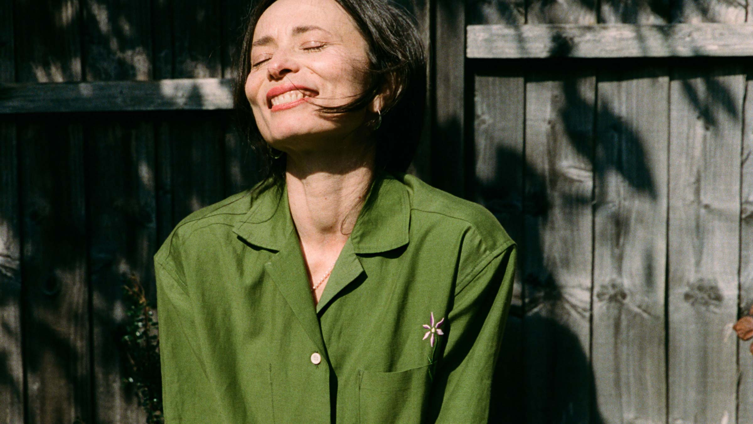 Frances Shirt in olive green linen, worn in sunlight — made in the UK by Saywood