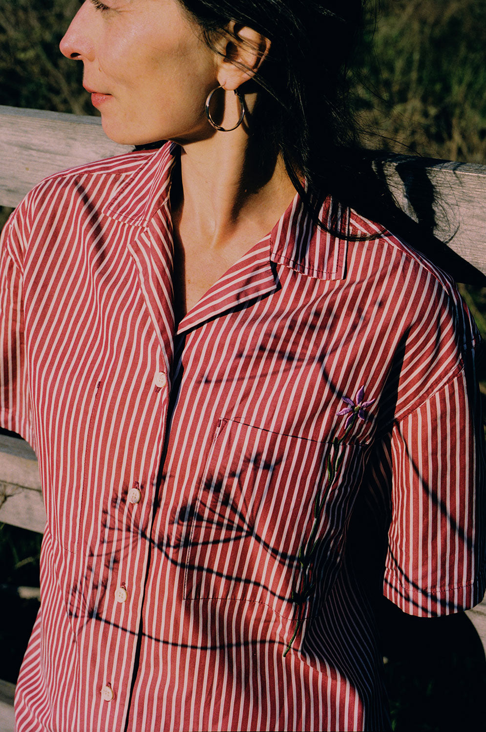 Detail of Frances Cuban shirt revere collar and embroidered flower, berry red stripe surplus cotton by Saywood