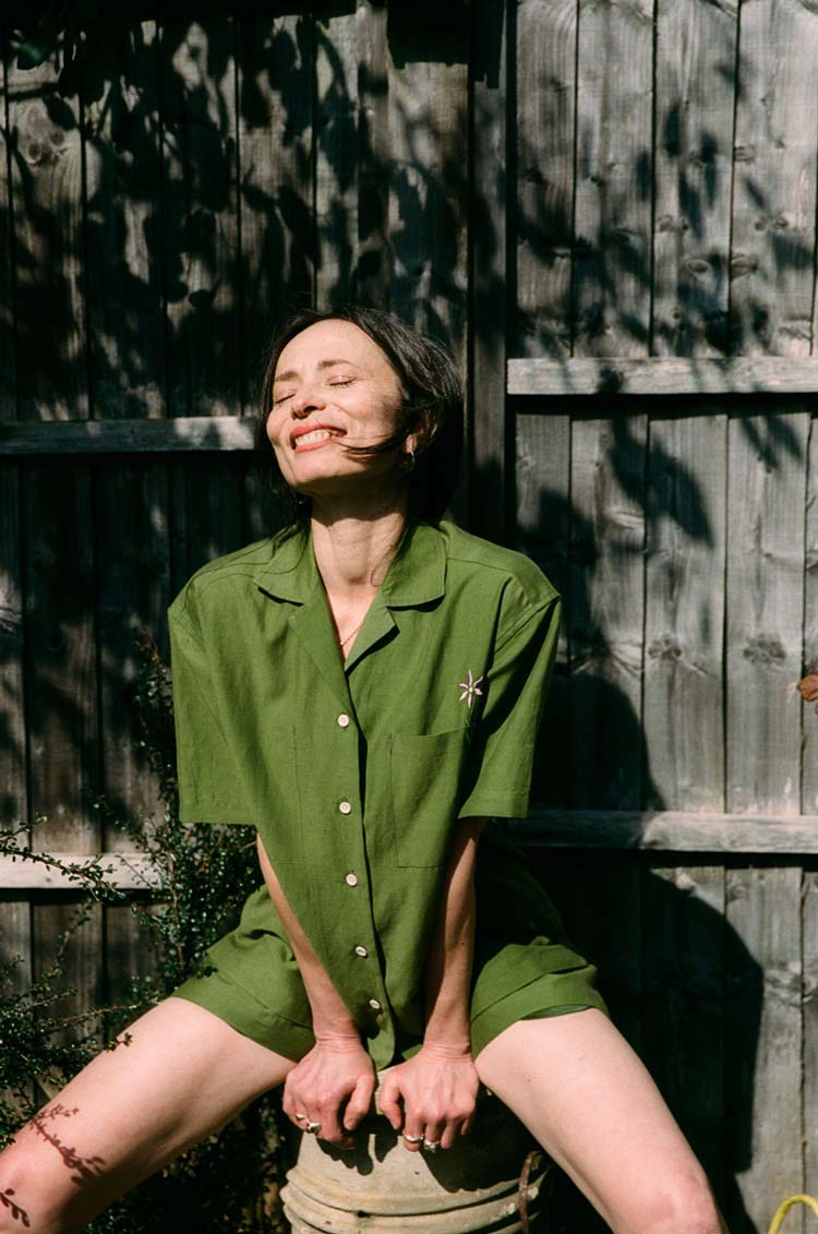 rances Short Sleeve Shirt and Bessie Shorts co-ord in olive green linen, worn in dappled sunlight — made in the UK by Saywood"