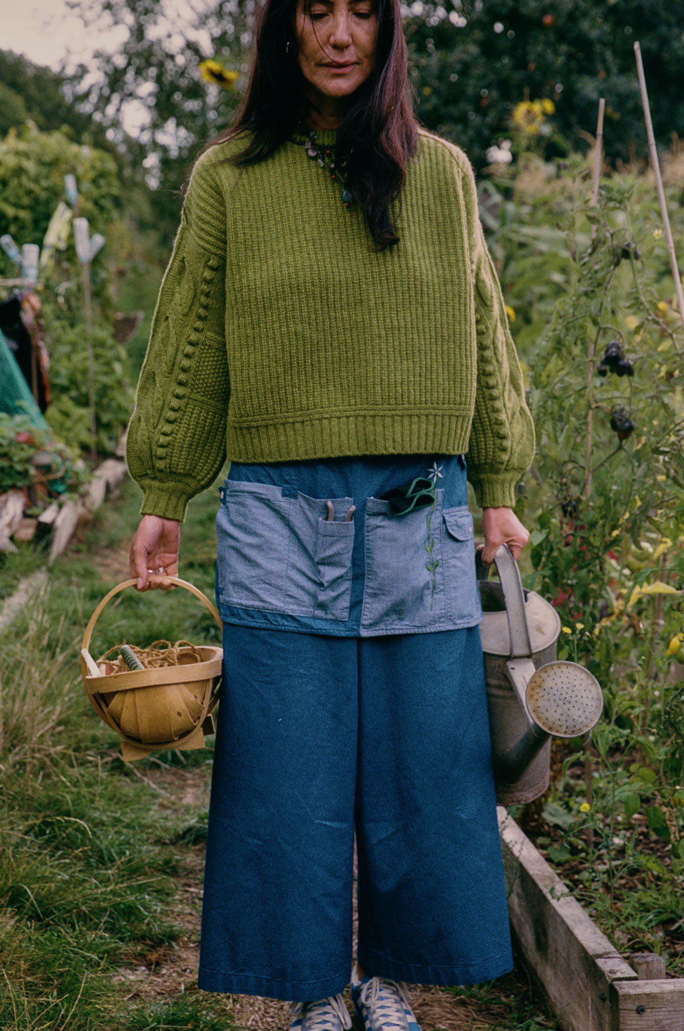Styling inspiration: Amelia wide leg trousers in Japanese denim with Adams moss green sweater, made in London by Saywood. Worn with denim apron.