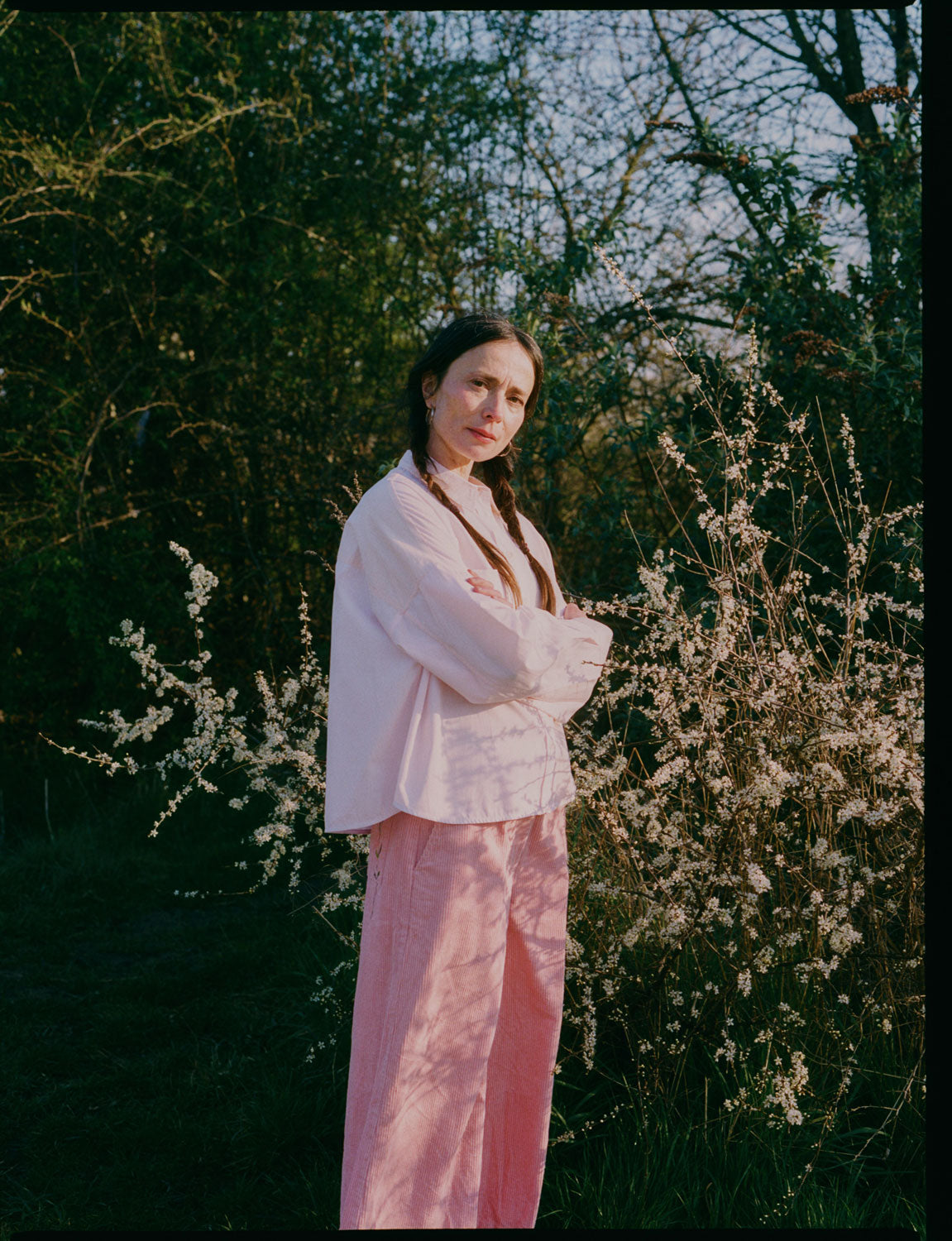 Lifestyle shot: Lela pink orange colourblock boxy shirt with Amelia pink corduroy trousers, made in London by Saywood