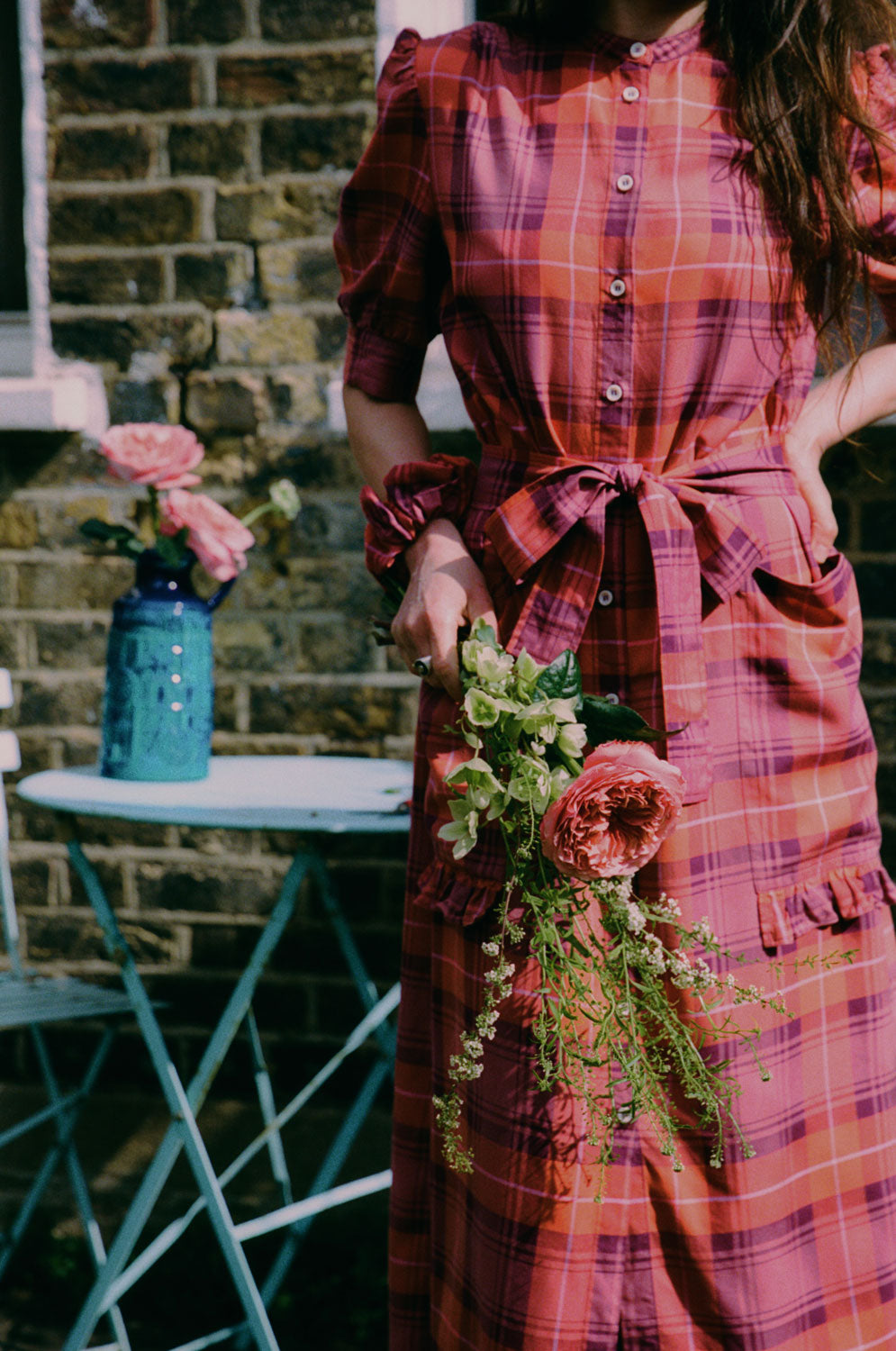Rosa red tartan puff sleeve shirtdress with tie belt and ruffled pockets, lifestyle styling by Saywood