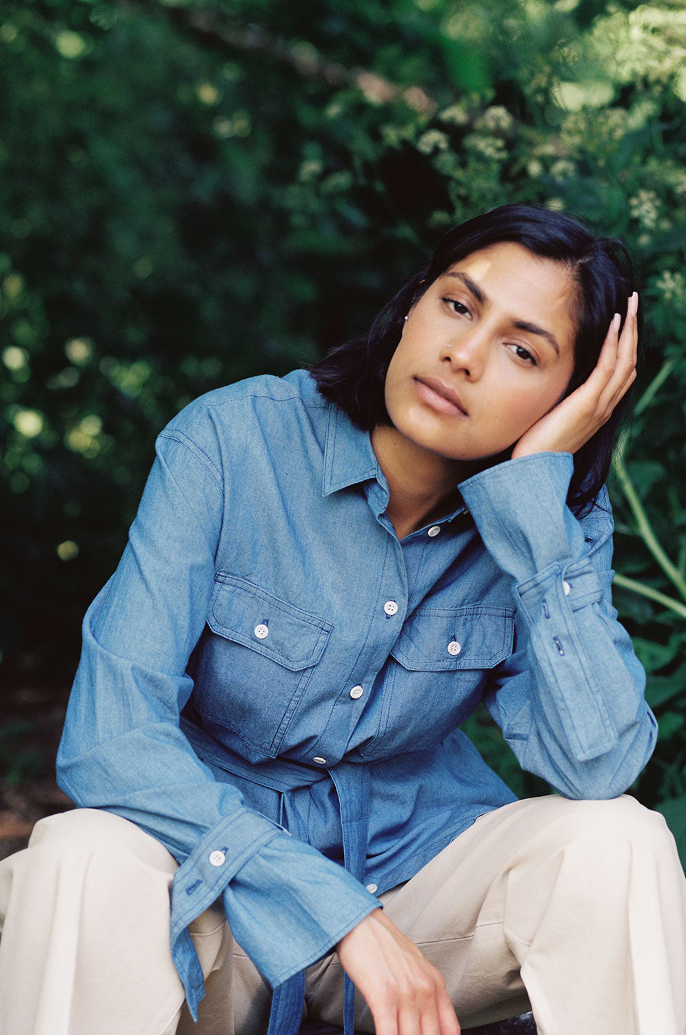 Close-up of Zadie oversized denim shirt showing belted cuffs and utility details, Japanese denim by Saywood