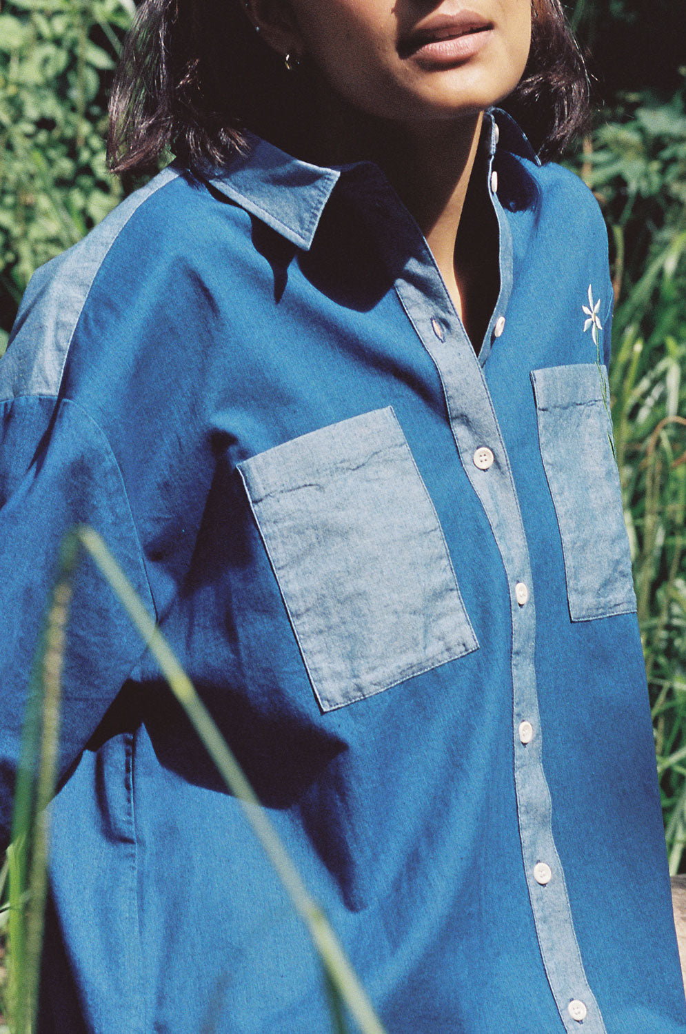 Close-up of Etta Japanese denim shirtdress showing contrast wash and fabric texture