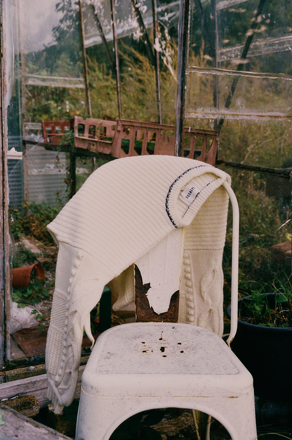 Adams boxy sweater in cream hanging over chair showing textured balloon sleeves with leaf detail, Scottish lambswool made in the UK