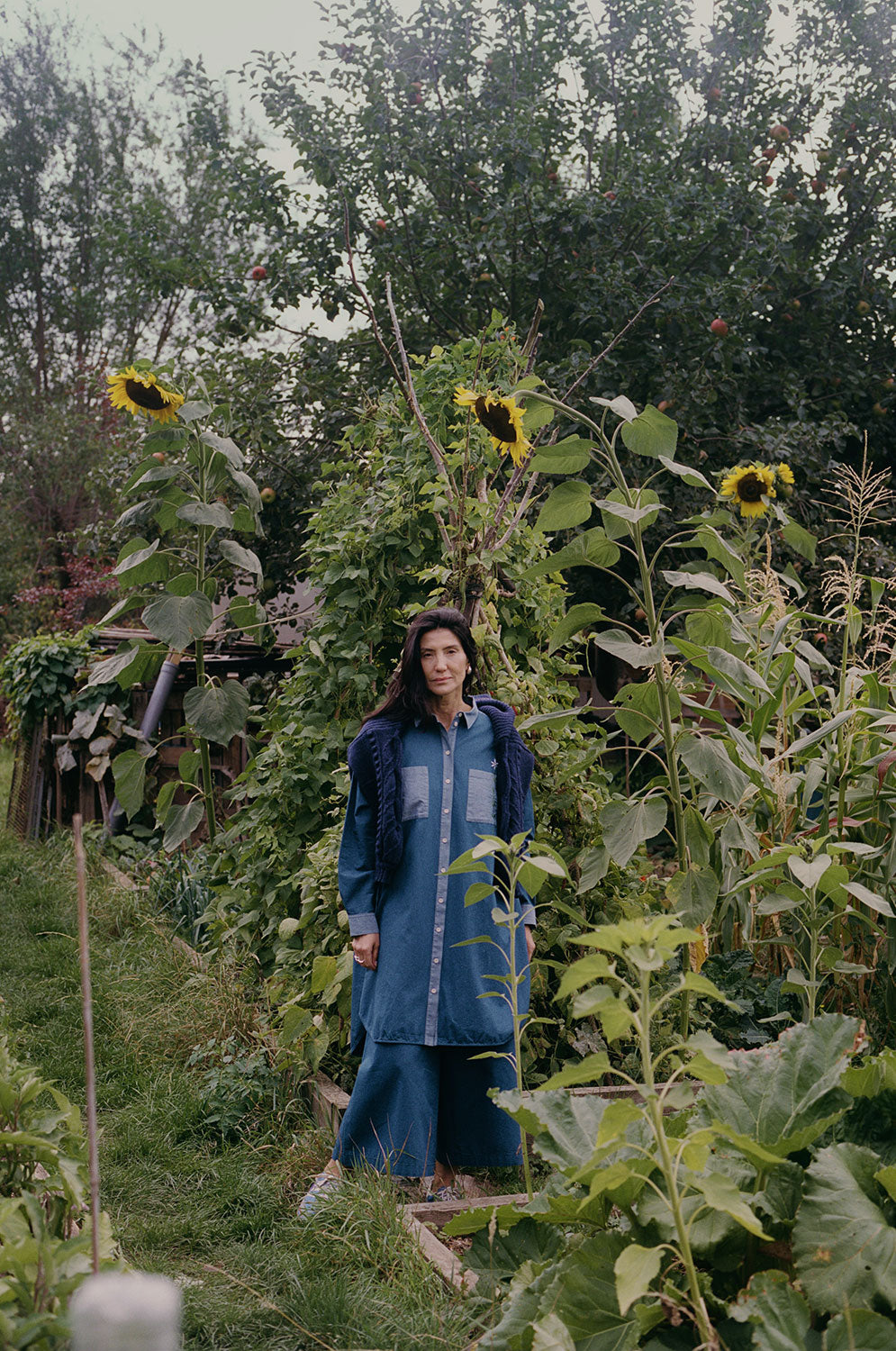 Etta indigo Japanese denim shirtdress layered with Amelia trousers and navy cardigan