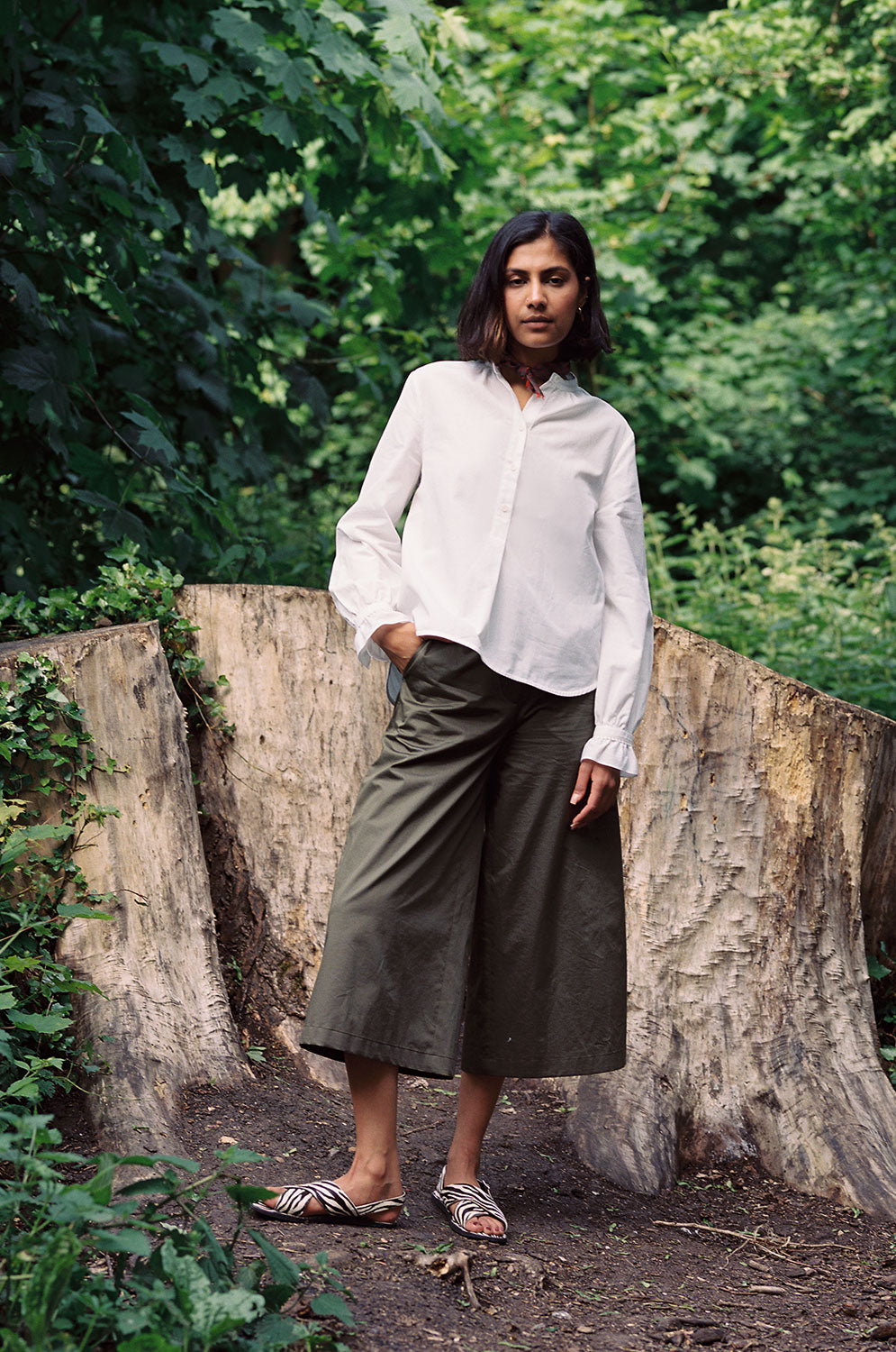Styling inspiration: Amelia khaki culotte trousers with white Marie blouse and zebra print sandals, made in London by Saywood