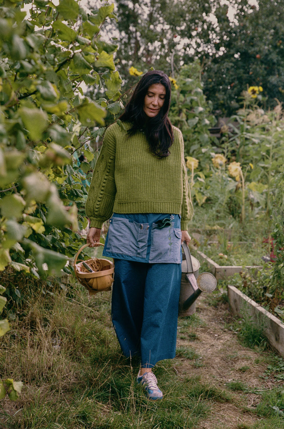 Amelia wide leg culotte trousers in Japanese denim with Adams fisherman's rib sweater, lifestyle shot by Saywood