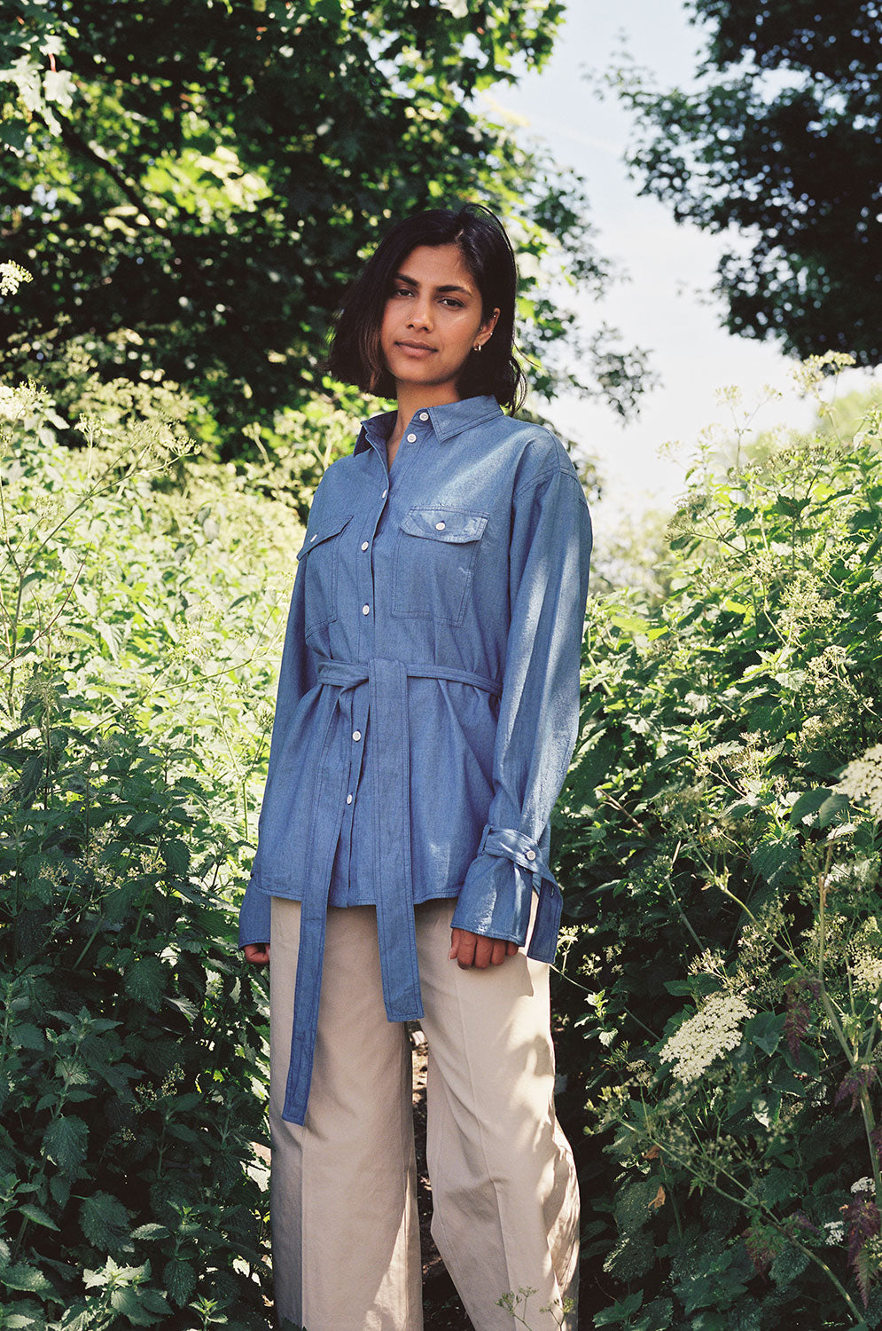 Zadie Japanese denim boyfriend shirt with detachable belt tied at waist, light wash by Saywood