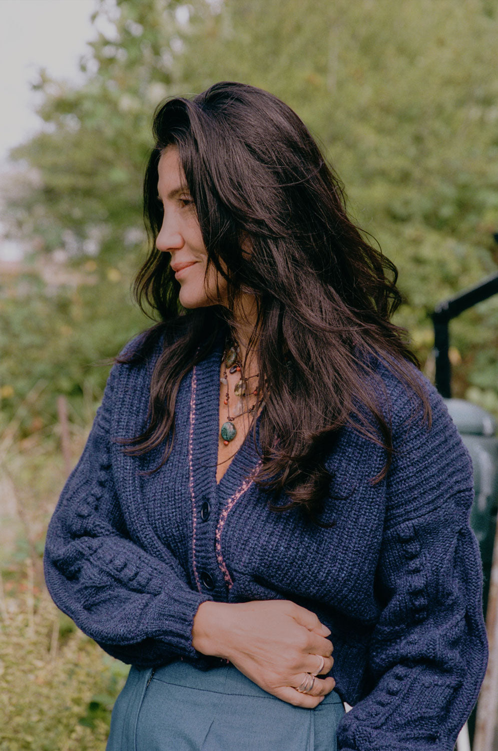 Frida navy lambswool cardigan showing hand-finished leaf sleeve detailing, luxury knitwear crafted in the UK