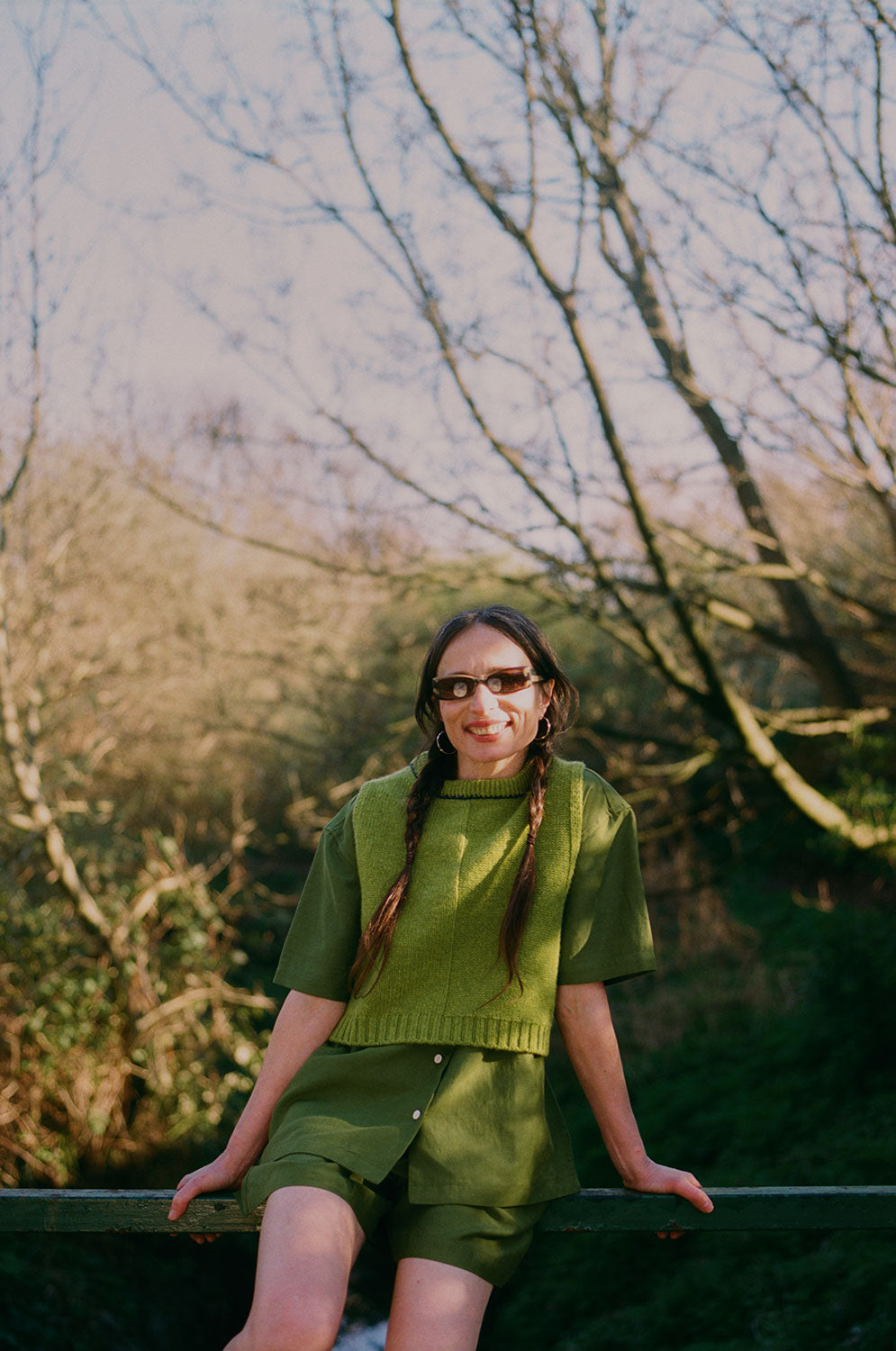 Styling detail: Bessie olive green tailored shorts styled for summer, made in London by Saywood
