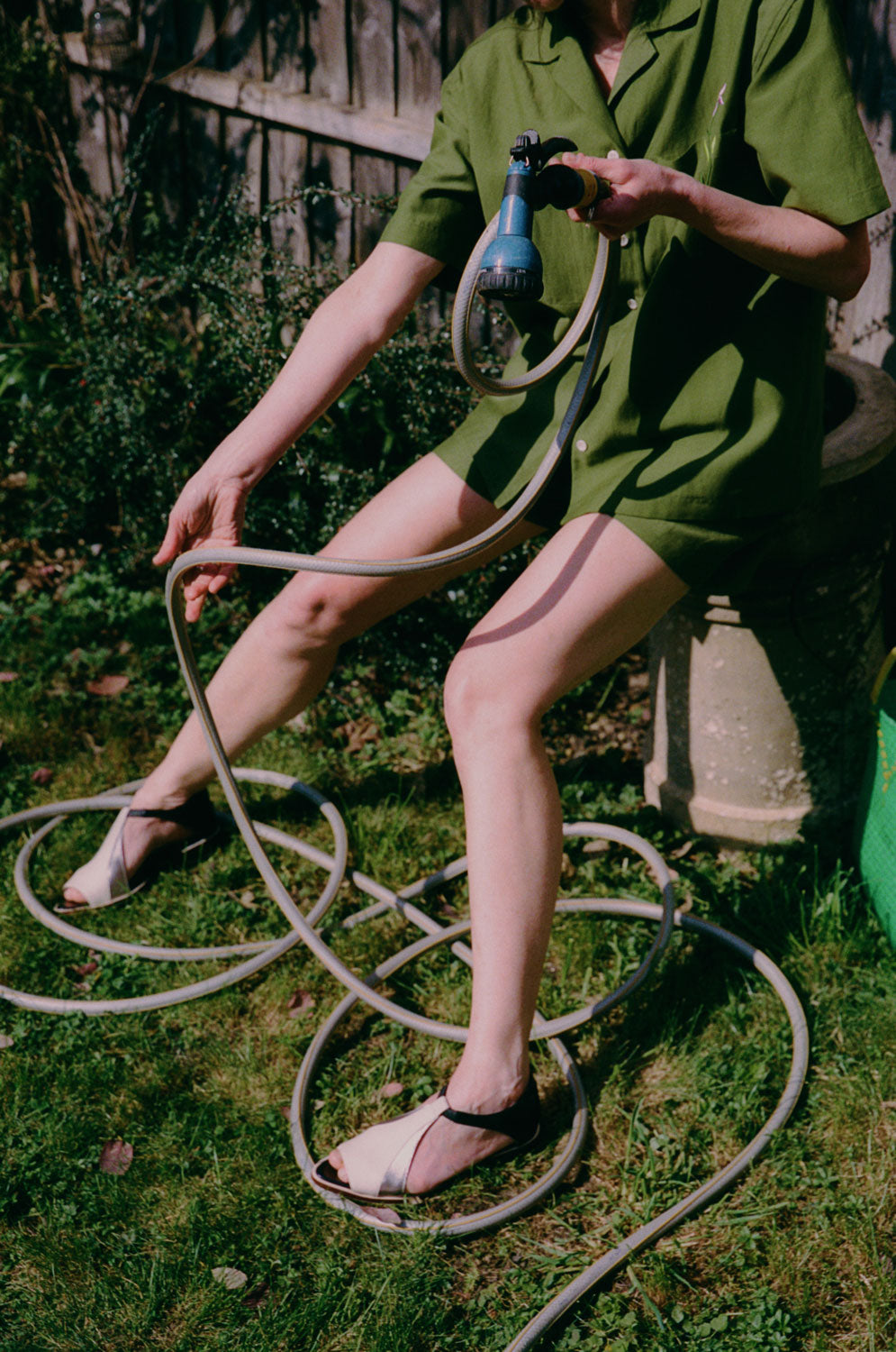Bessie A-line shorts in rich olive green with tailored fit and mid-thigh length by Saywood