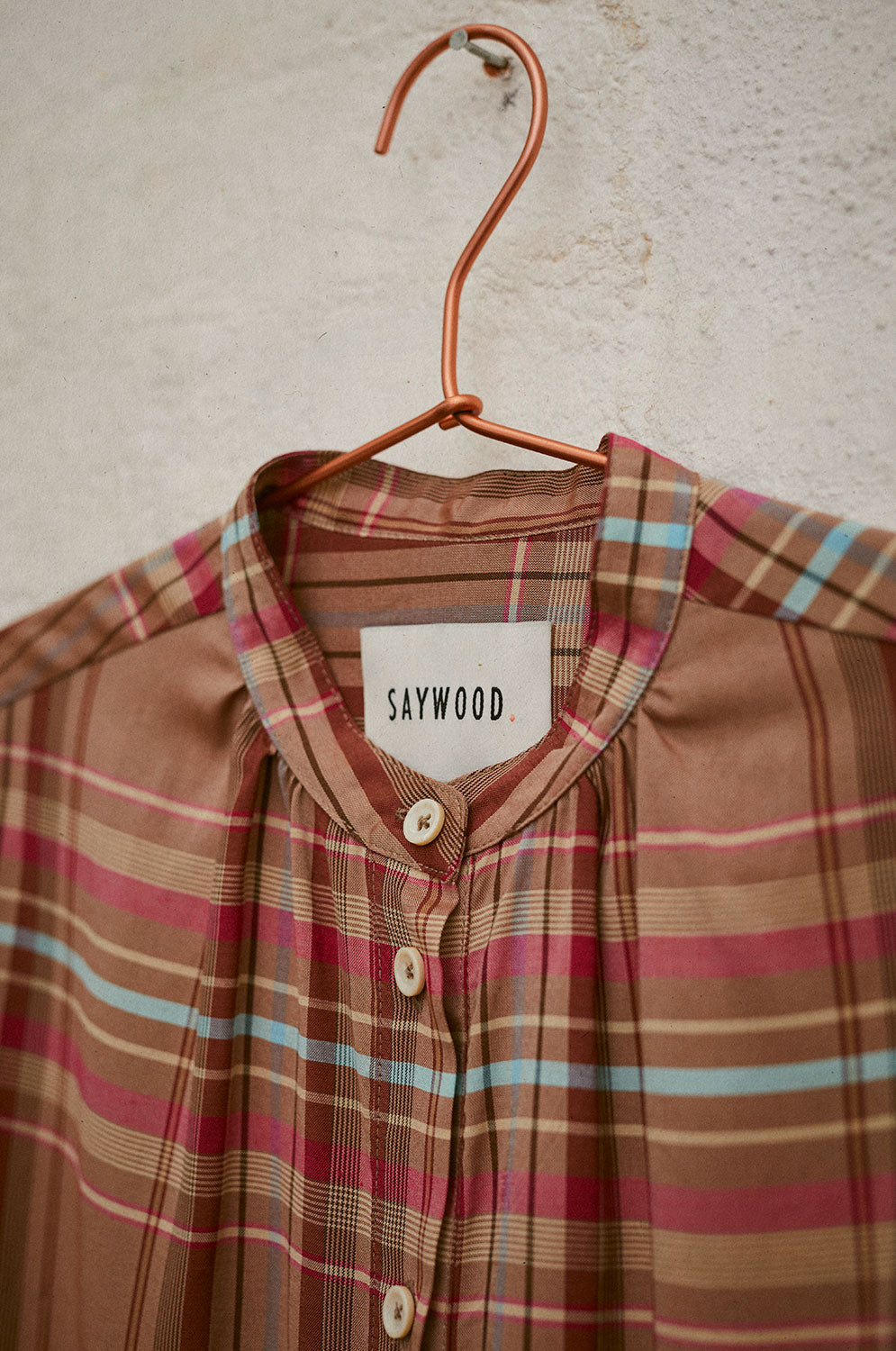 Detail view of Marie pink check blouse gathered neckline, limited edition surplus fabric by Saywood
