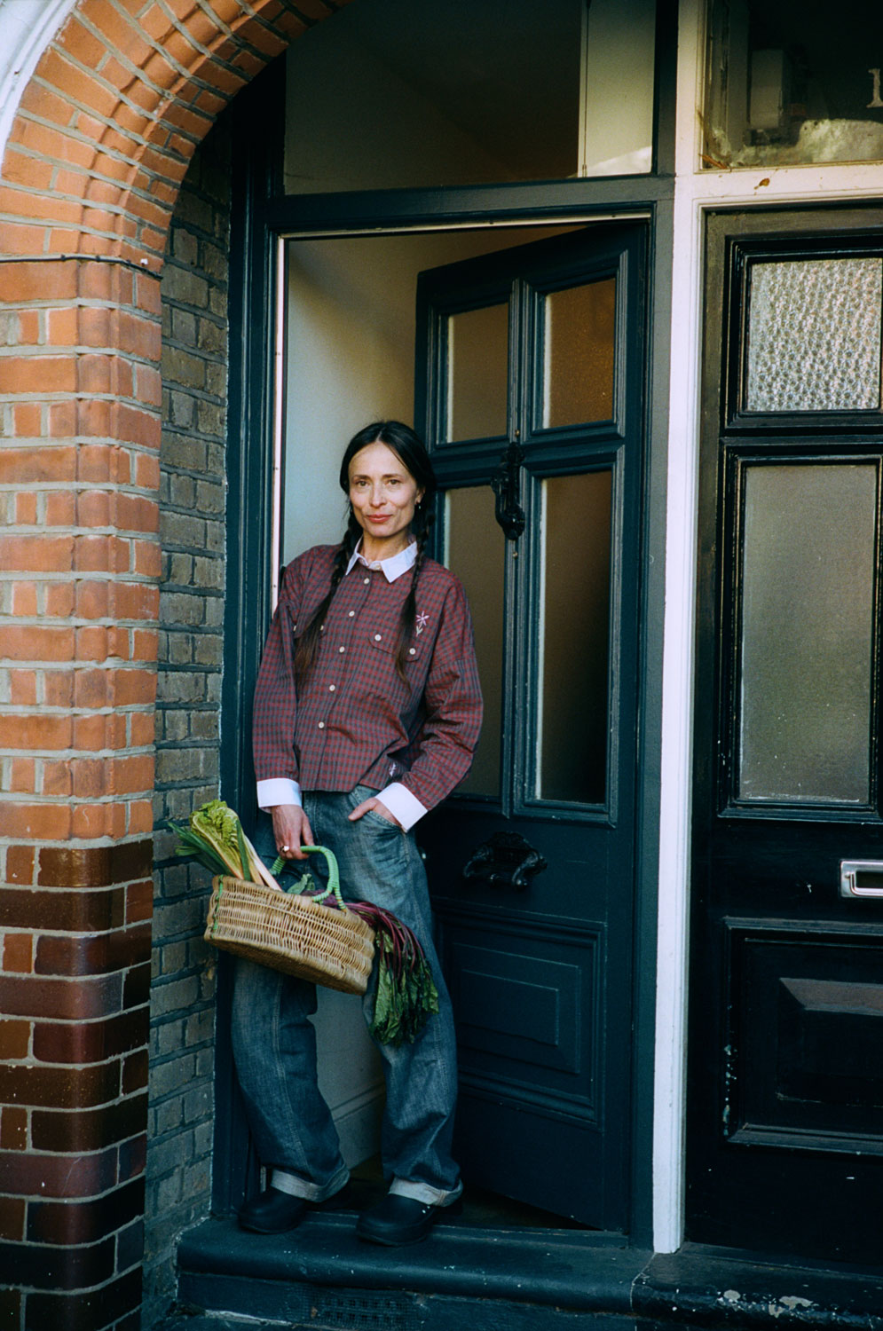 Jules utility shirt in red check styled with mid-wash jeans, outdoor lifestyle shot by Saywood