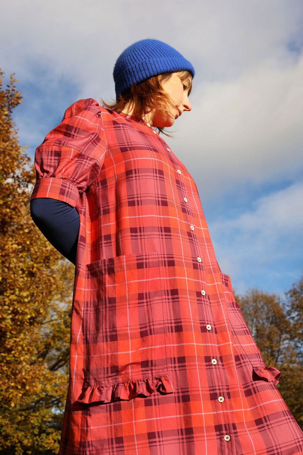 Rosa puff sleeve shirtdress in red tartan showing ruffled pocket detail, handmade in London by Saywood