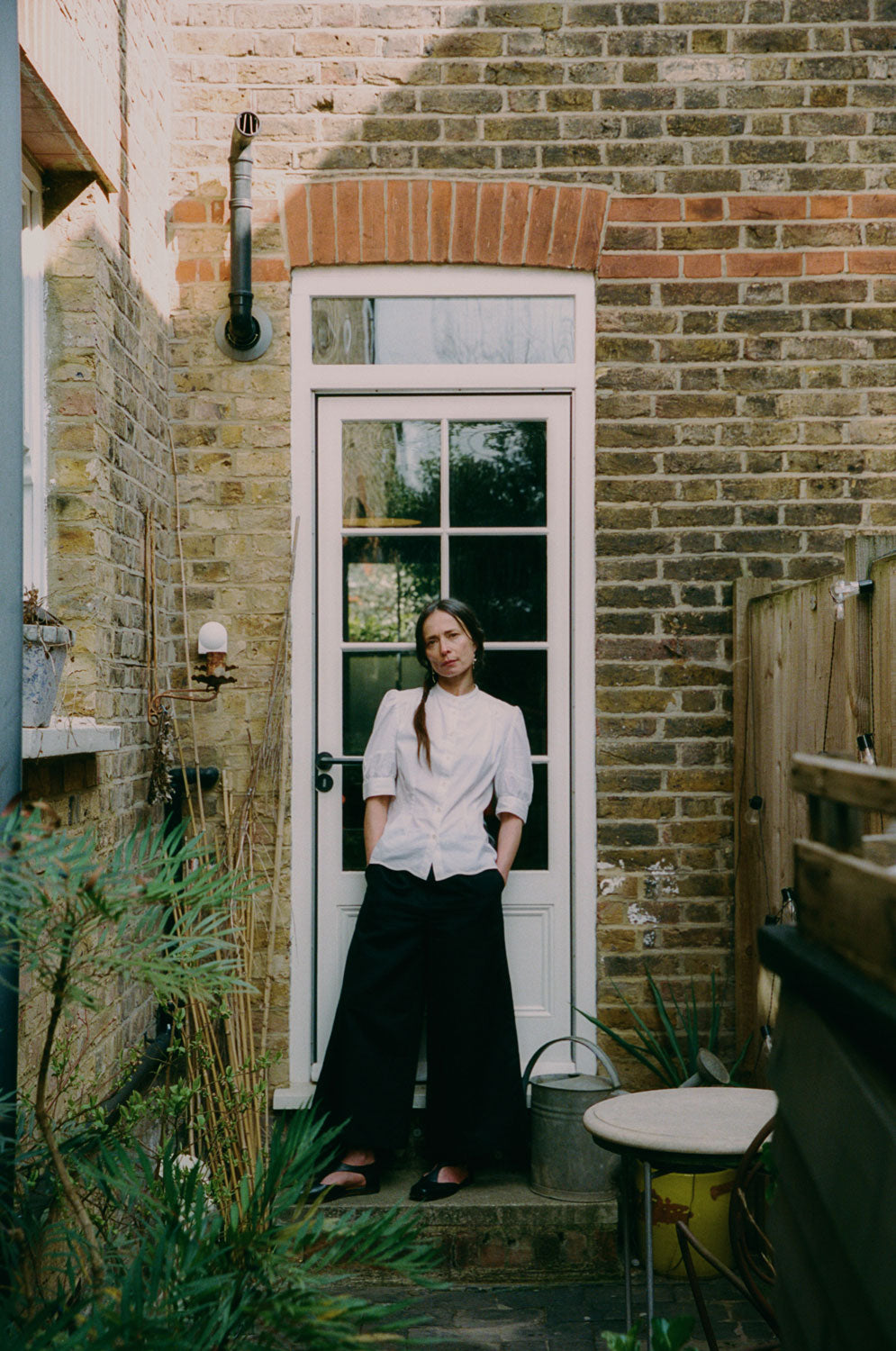 Detail of Joni blouse grandad collar with lace trim and button placket, white cotton bamboo by Saywood