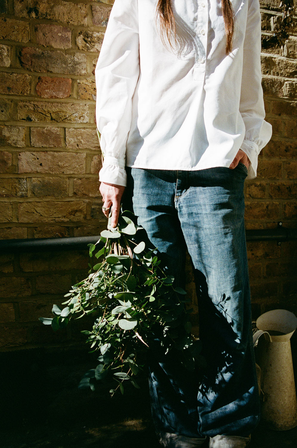 Styling inspiration: Marie white lace-trimmed blouse with gathered cuffs, made in London by Saywood. Worn with jeans.