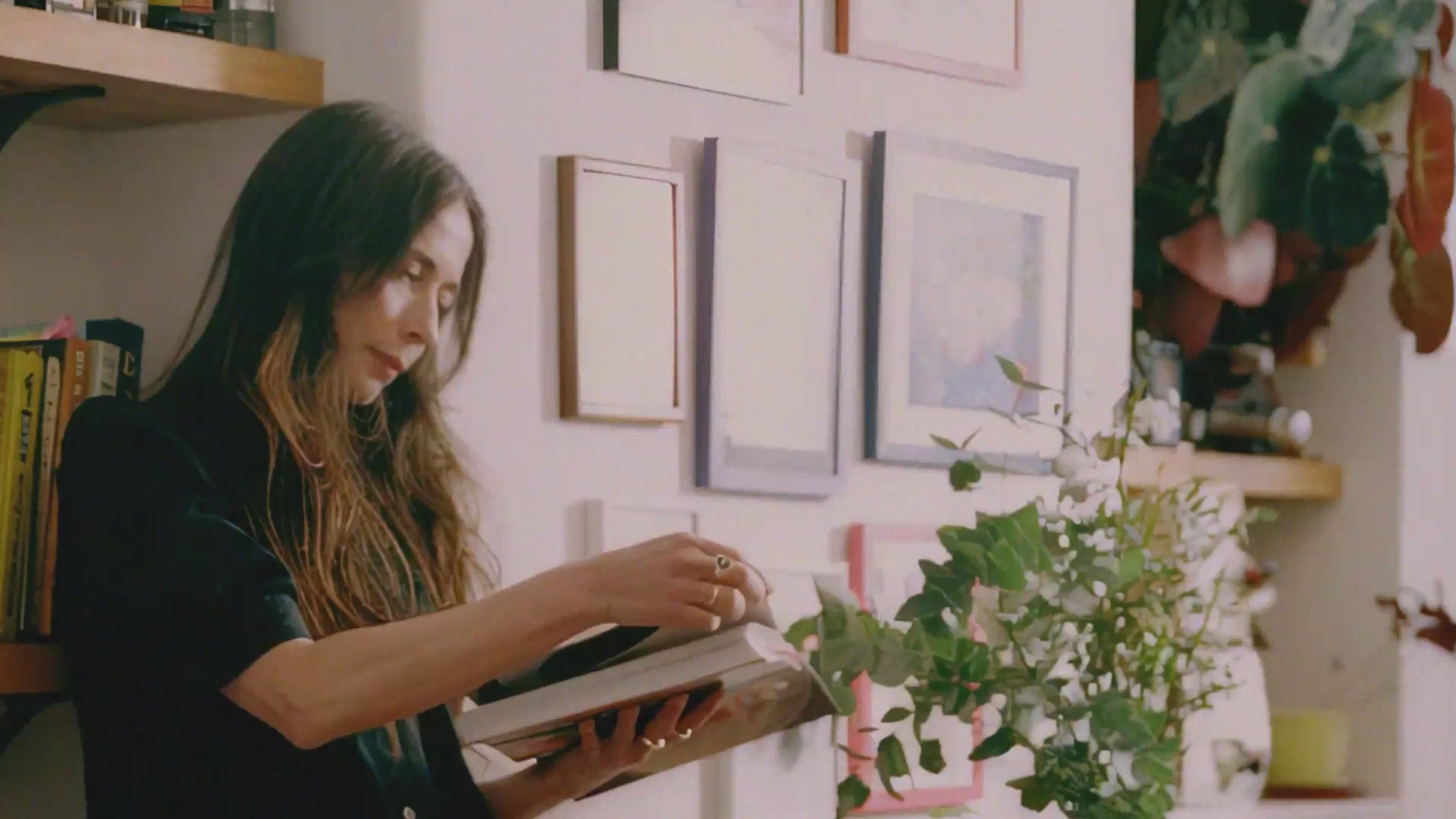 Rosa Shirt Dress in black Japanese denim, worn at home in a relaxed interior setting — made in the UK by Saywood